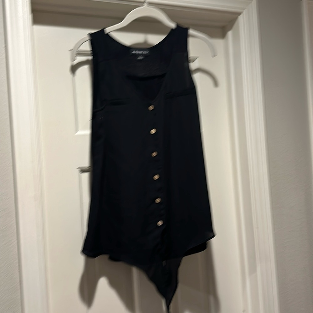 Sleeveless black top with button and tie detail